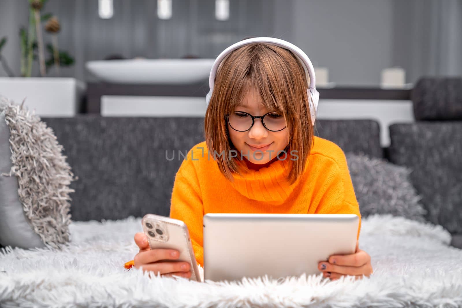 child uses a laptop at home for online learning and entertainment. High quality photo
