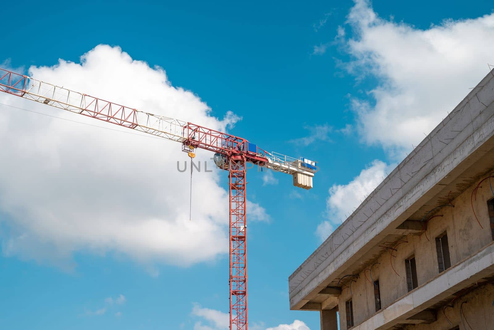 Construction crane working on large construction site