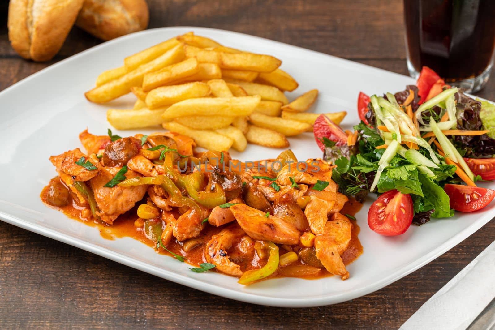 Grilled julienne cut chicken with french fries and salad