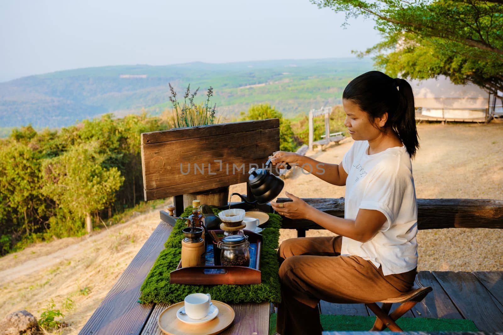 women making drip coffee in the mountains of Thailand by fokkebok