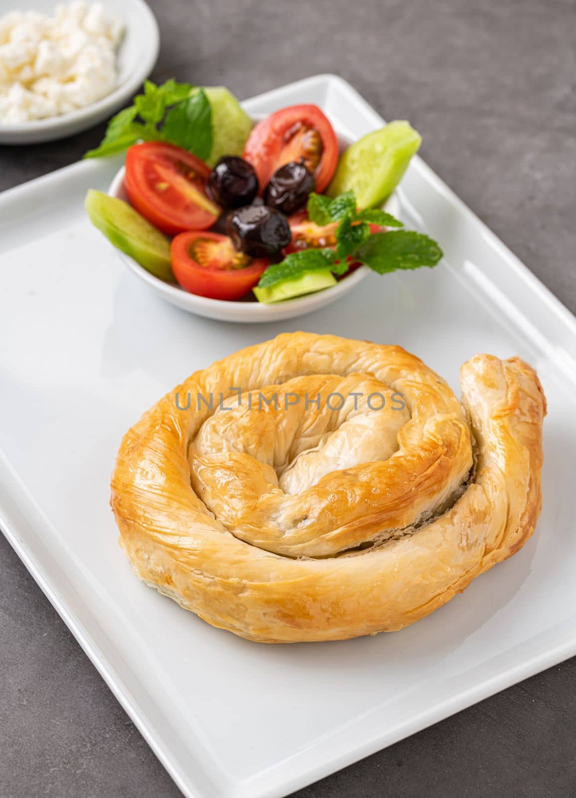 Traditional Turkish pastry made with spinach and cheese wrapped in phyllo. Turkish name gul boregi or gul borek by Sonat