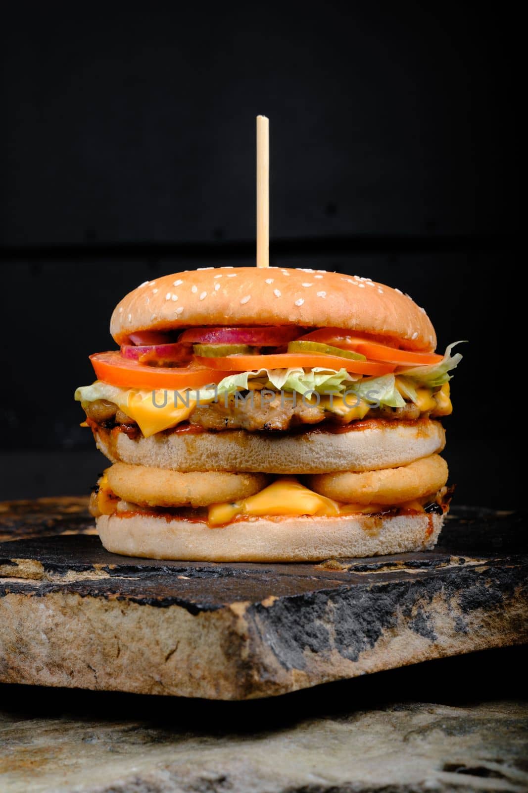 Rustic tasty Burger on Stone Background by Symonenko