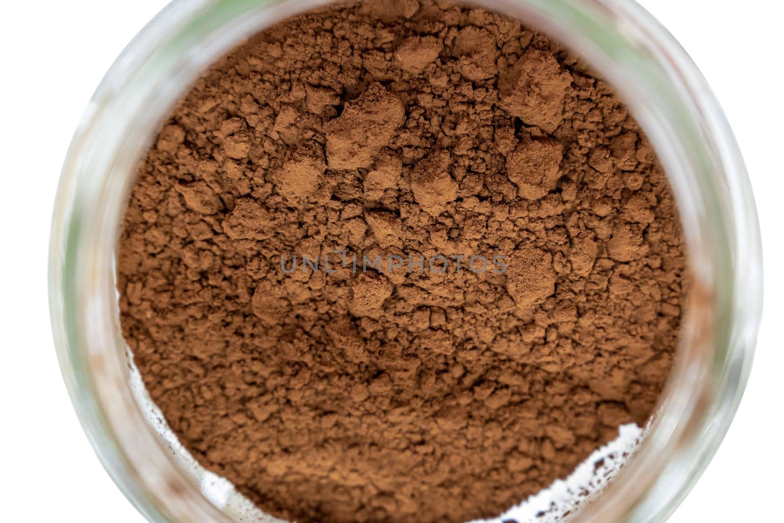 Top view of cocoa powder in glass jar by Sonat