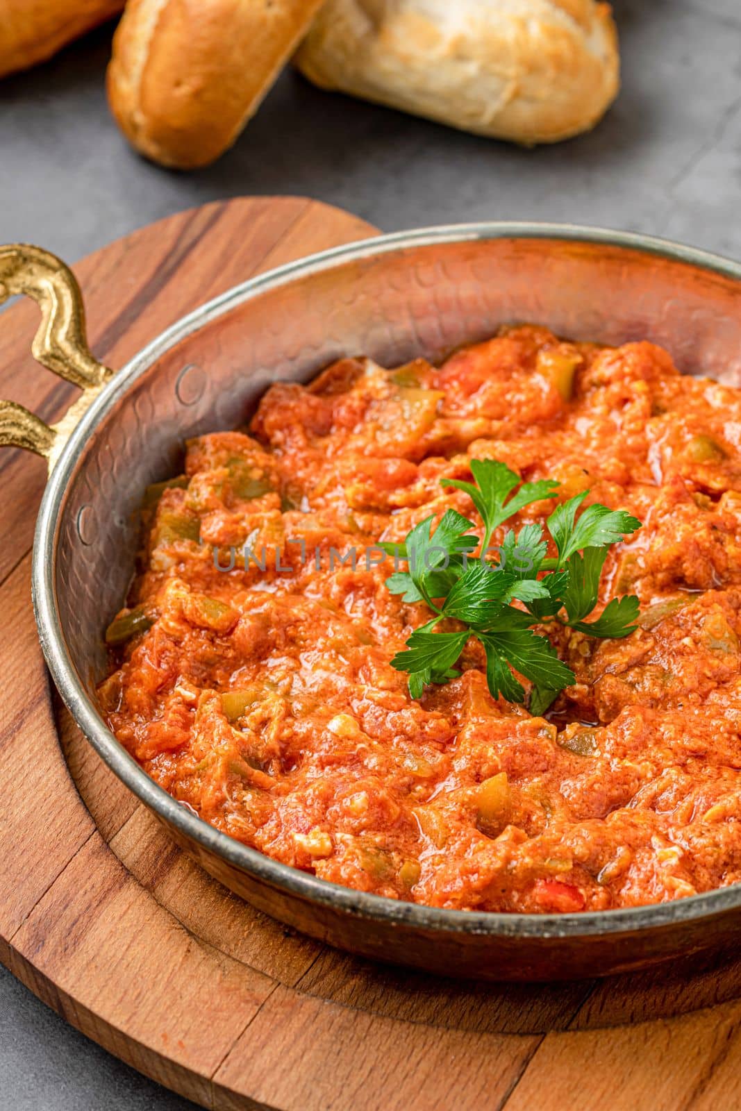 Turkish traditional menemen dish made with eggs, onions, peppers and tomatoes by Sonat
