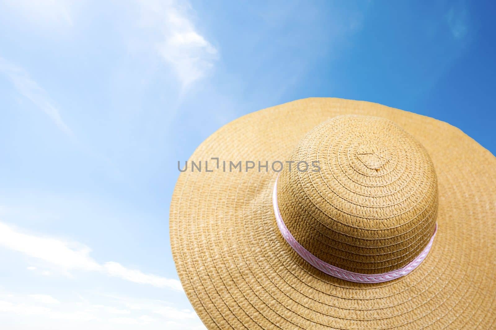 summer sunshine straw hat in blue sky on a sunny day. sunglasses summer concept with copy space blue background relaxation, Holiday,travel, beach,sun concept by Annebel146
