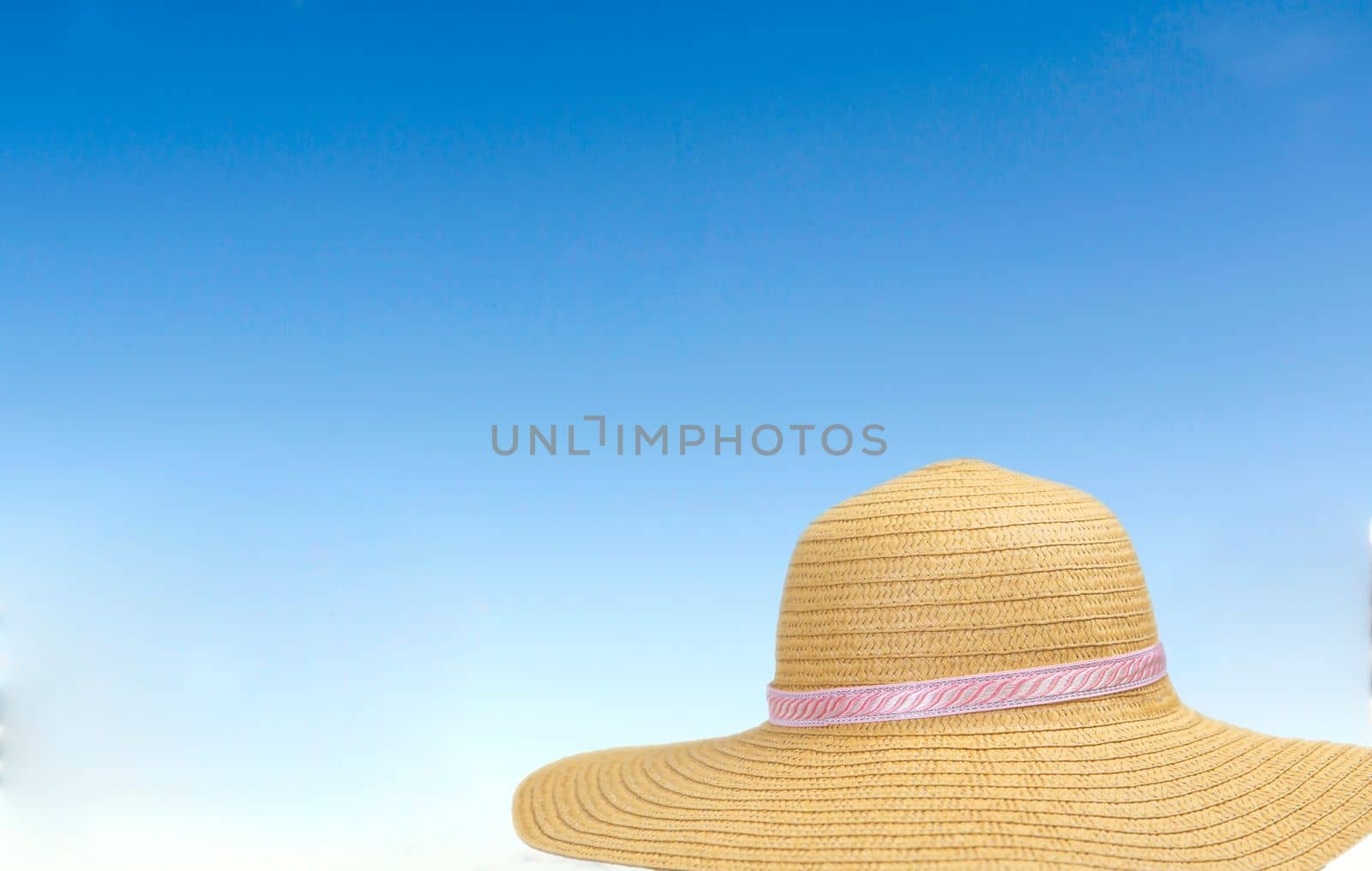 summer sunshine straw hat in blue sky on a sunny day. sunglasses summer concept with copy space blue background relaxation, Holiday,travel, beach,sun concept by Annebel146