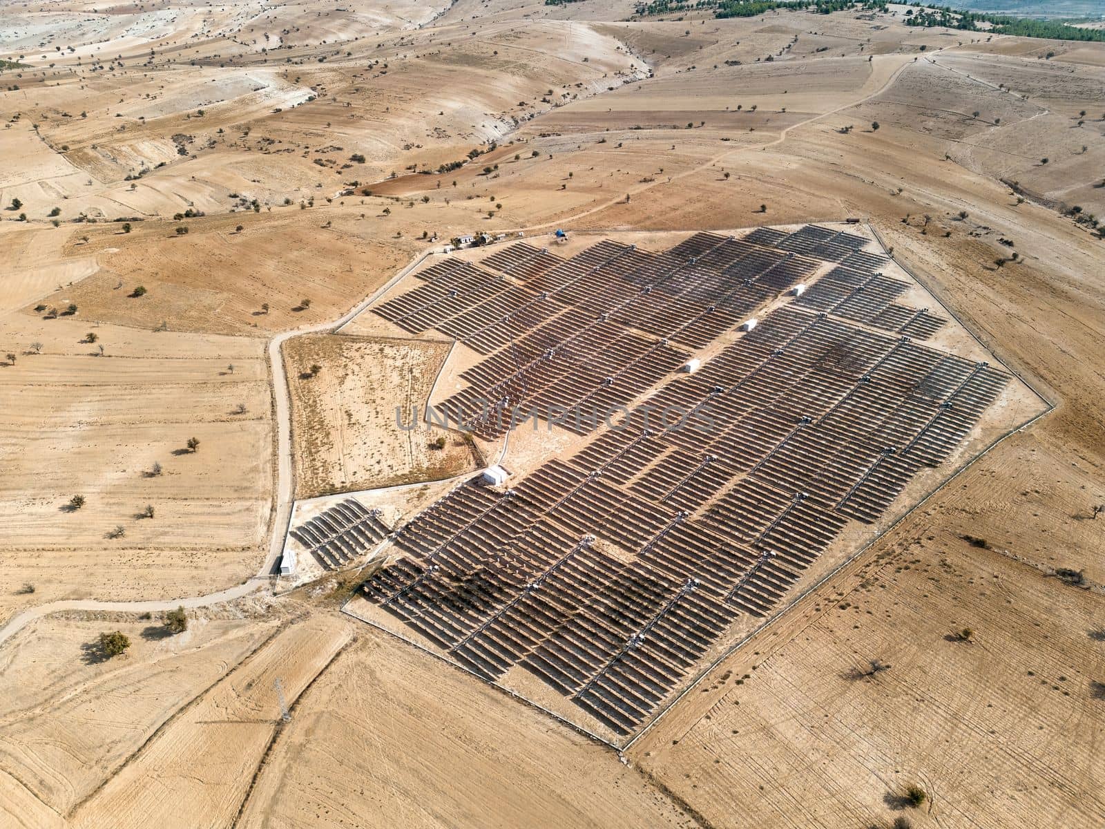 Solar panel field built on arid lands. Alternative green energy concept