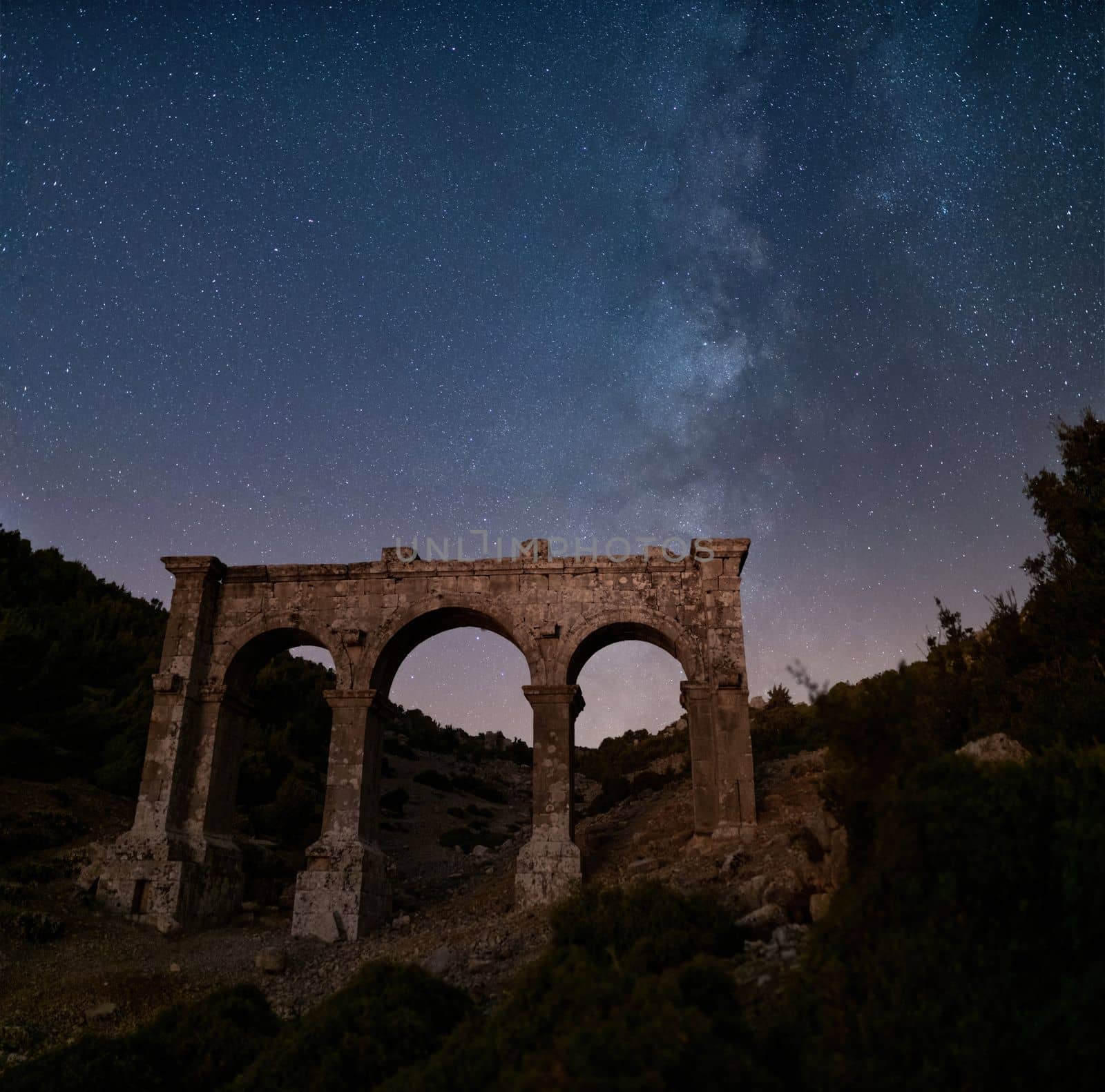 The ancient city of Ariassos, the city gate in a night when the Milky Way is visible by Sonat