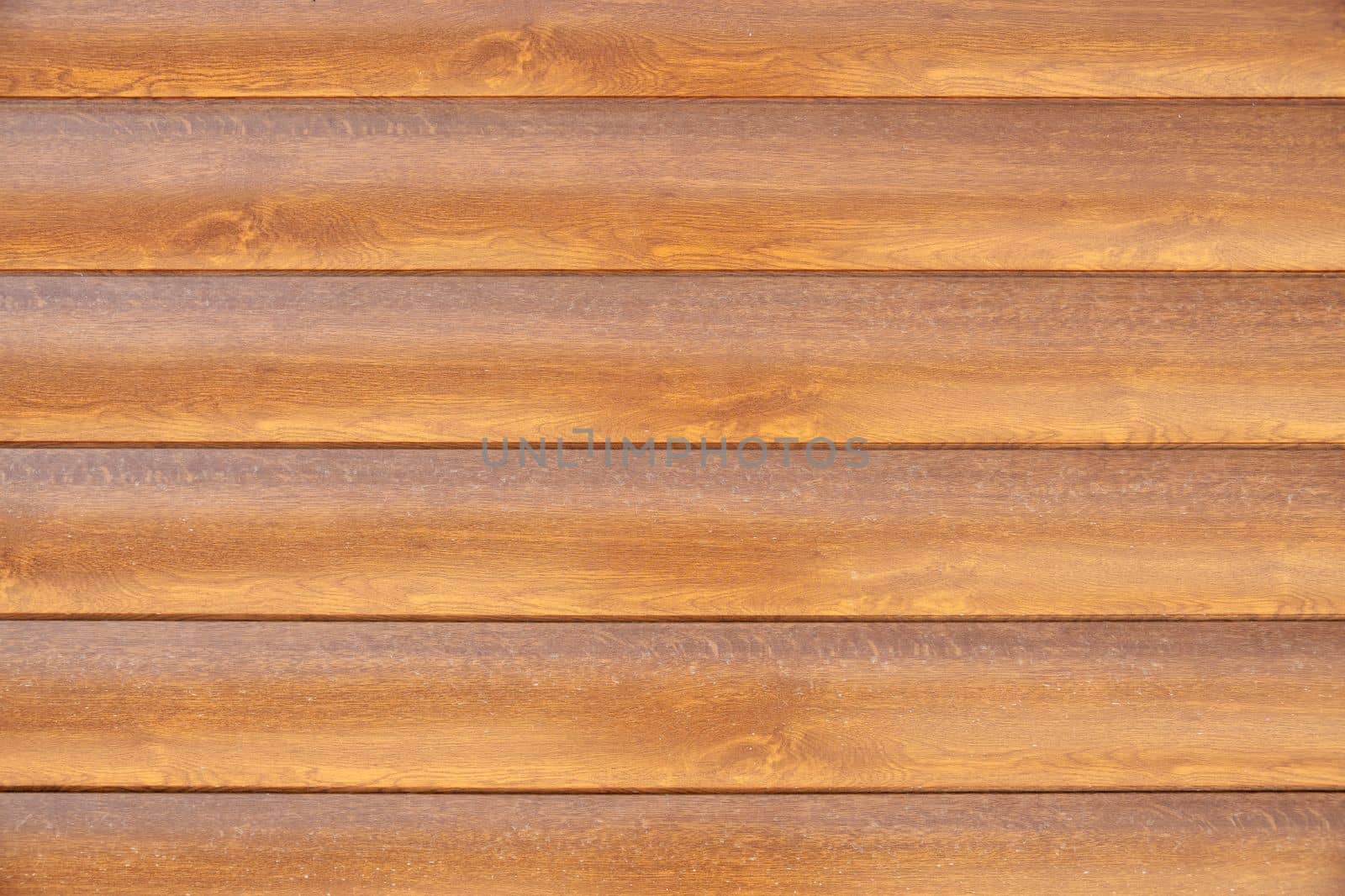 Facade cladding from solid wood handmade boards in brown color by Sonat