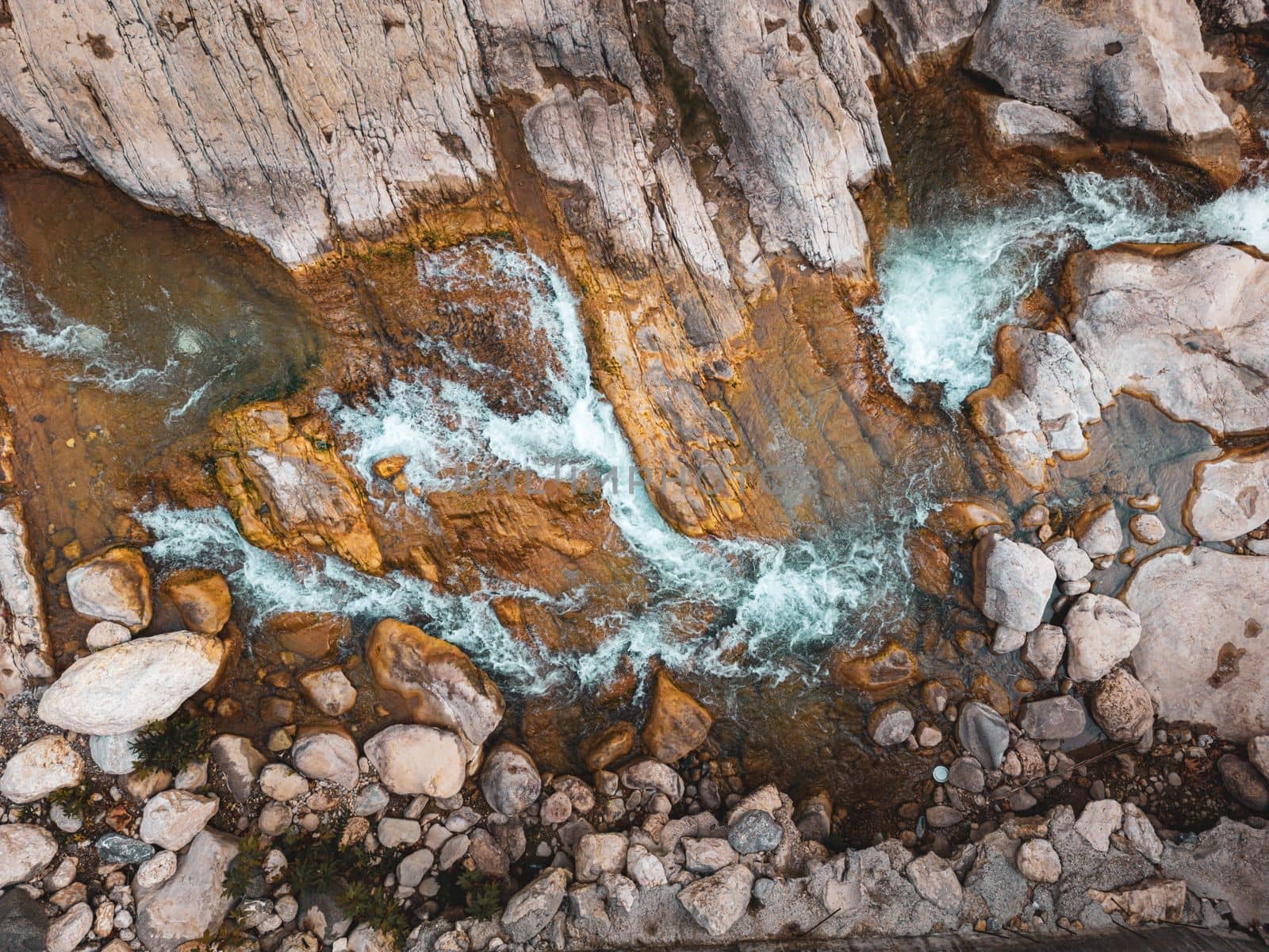 River flowing between rocks with motion blur shot with long exposure technique by Sonat