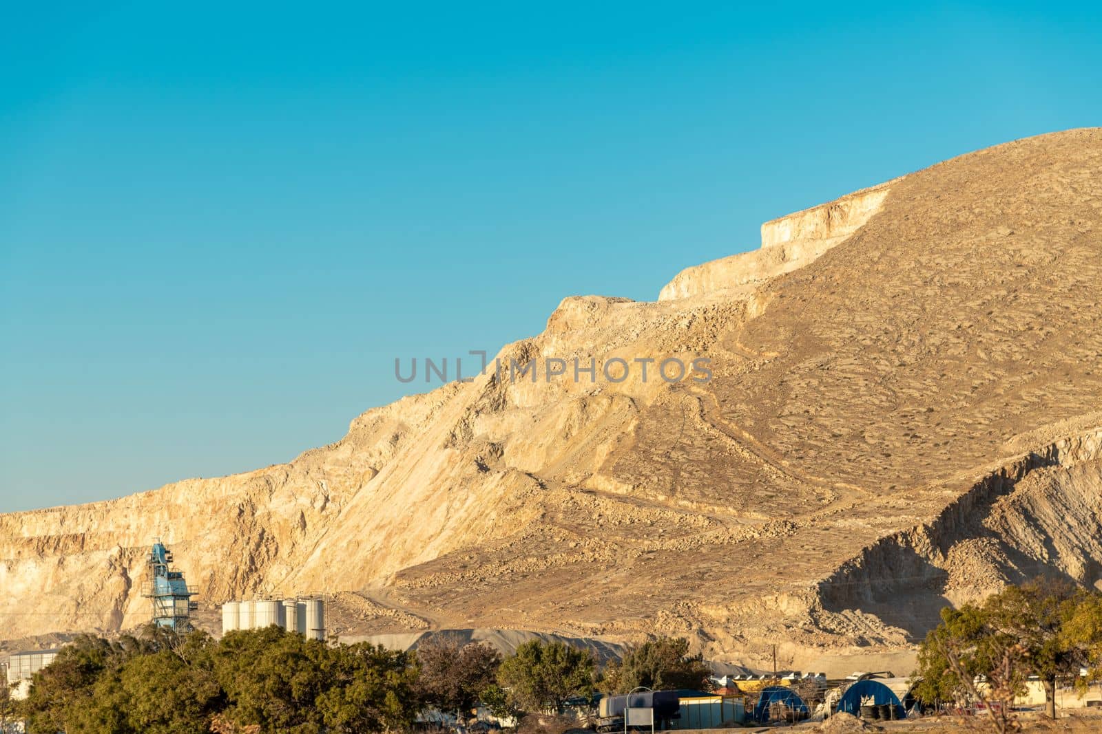 High hill quarry on a sunny day at sunset