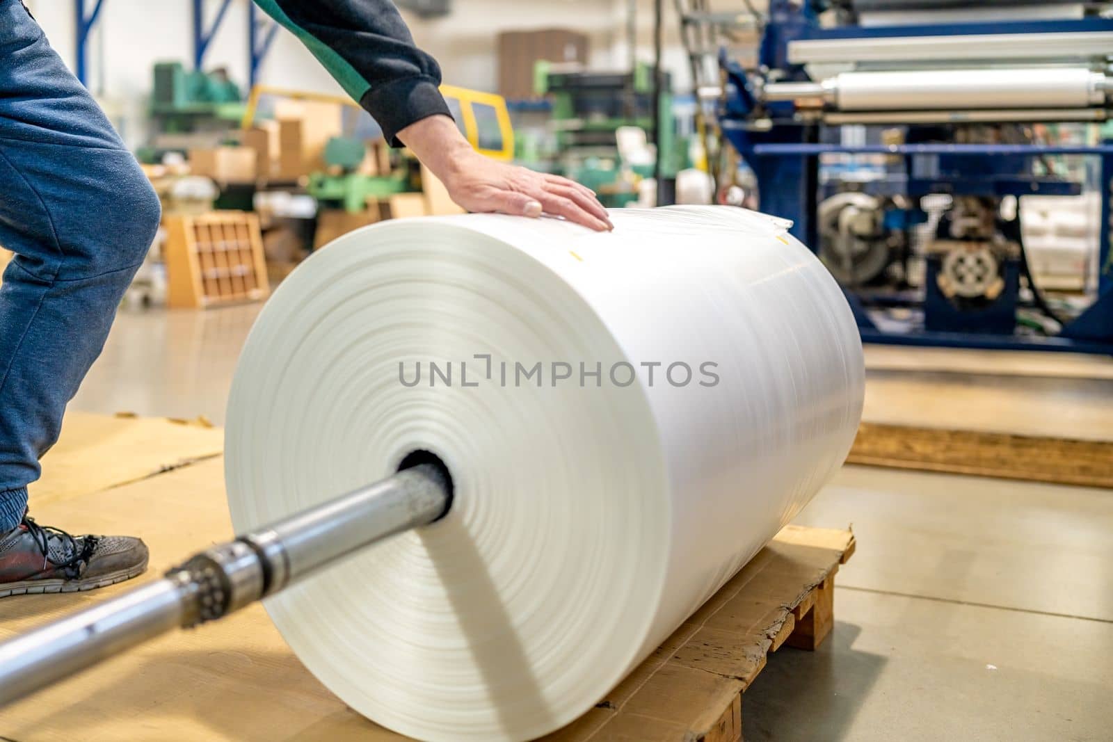 large plastic roll in the factory for the production of plastic packaging material and bags. 