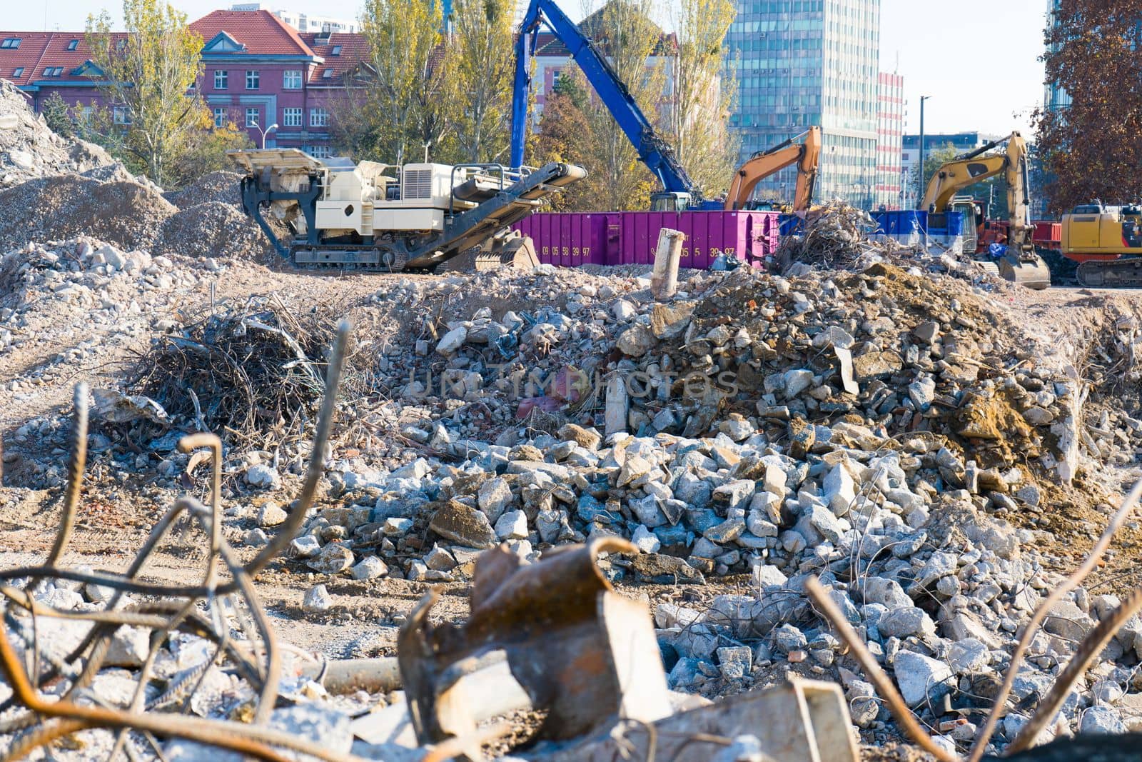 Background of process of demolition of building. Excavator breaking old house. by Zelenin