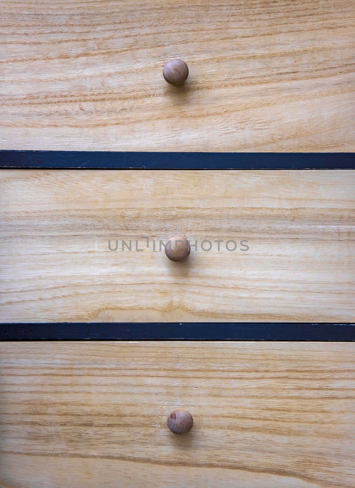 Wooden cupboard with drawers. Wooden furniture. Close-up by EdVal