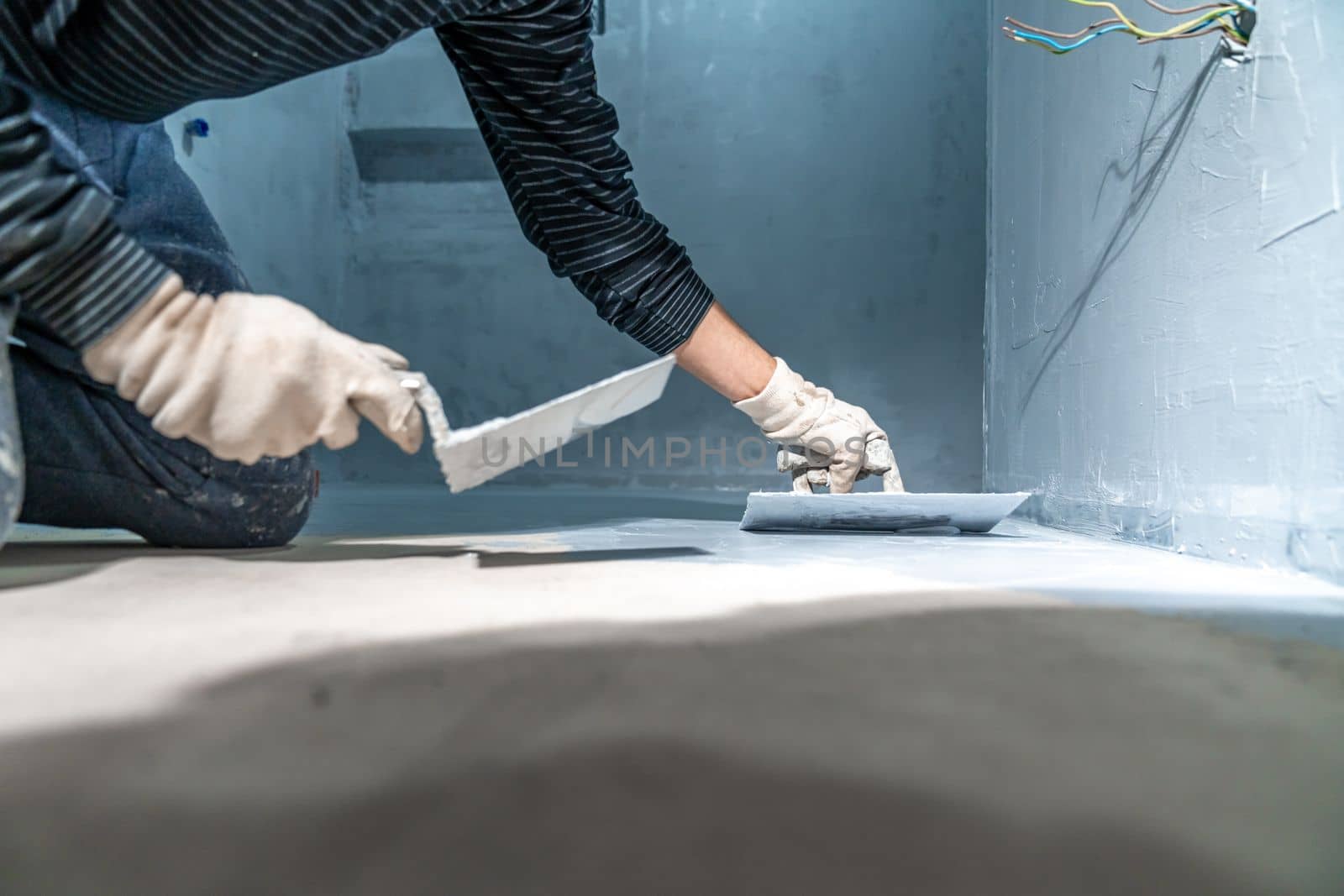 construction modifications of the floor and walls of a room in a new building. High quality photo