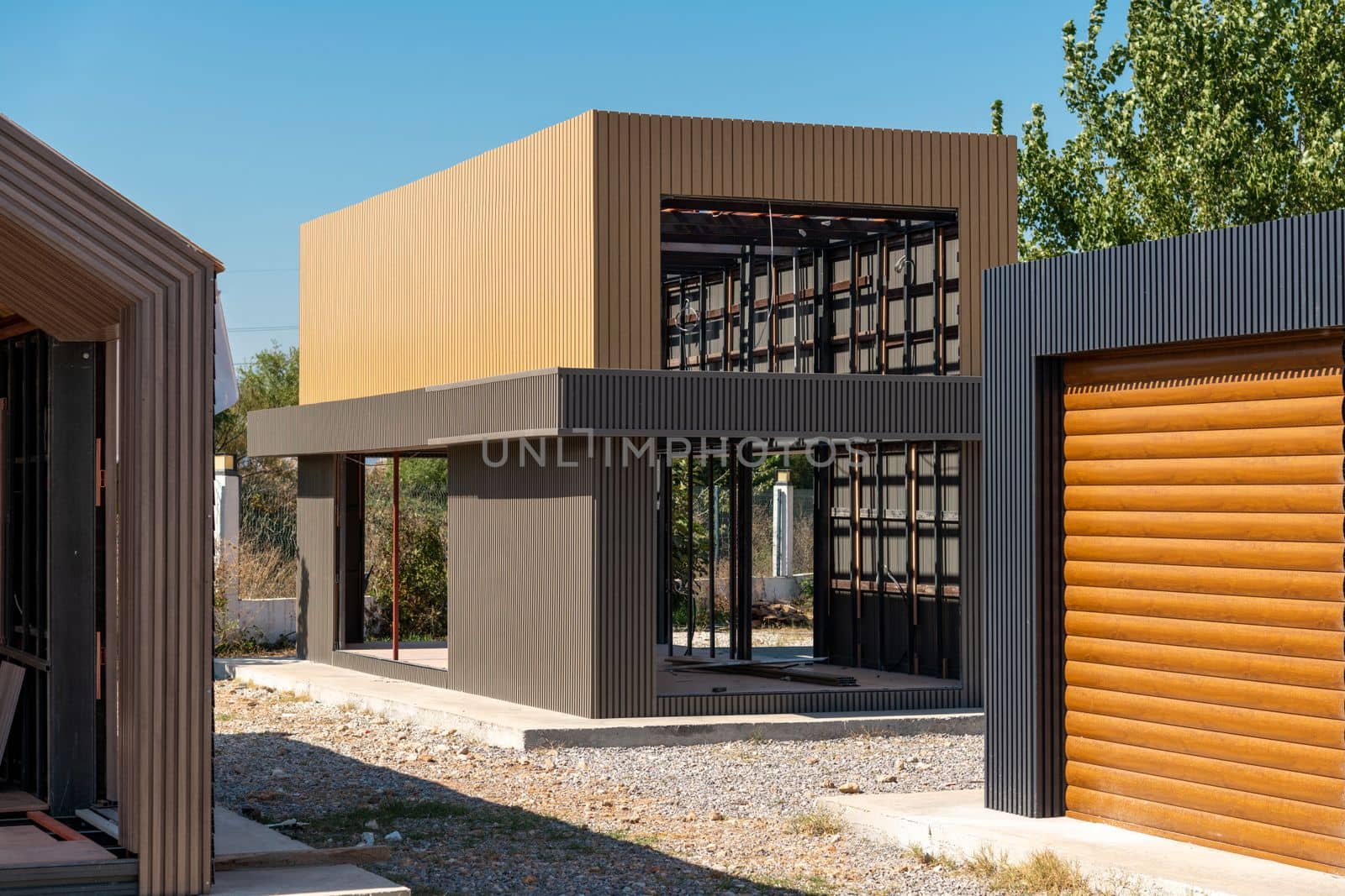 Newly built metal framed building with siding. Construction of a new tiny house. selective focus