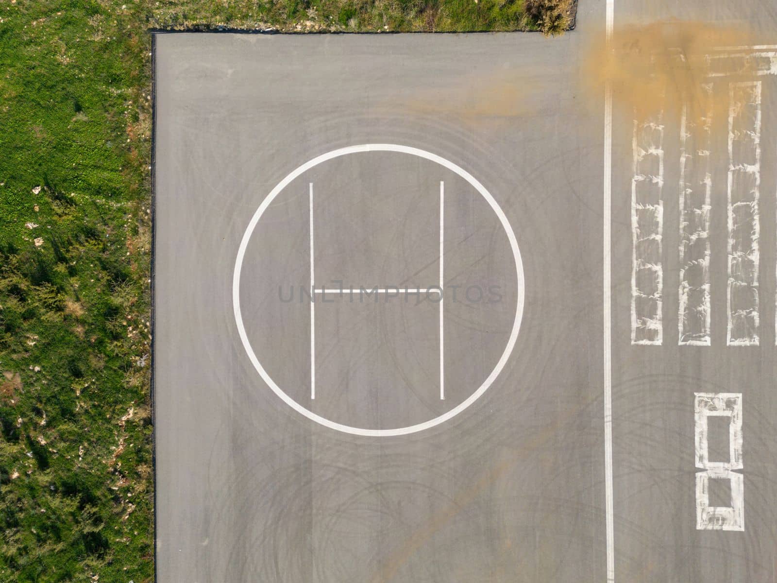 Helipad next to small airstrip in countryside by Sonat