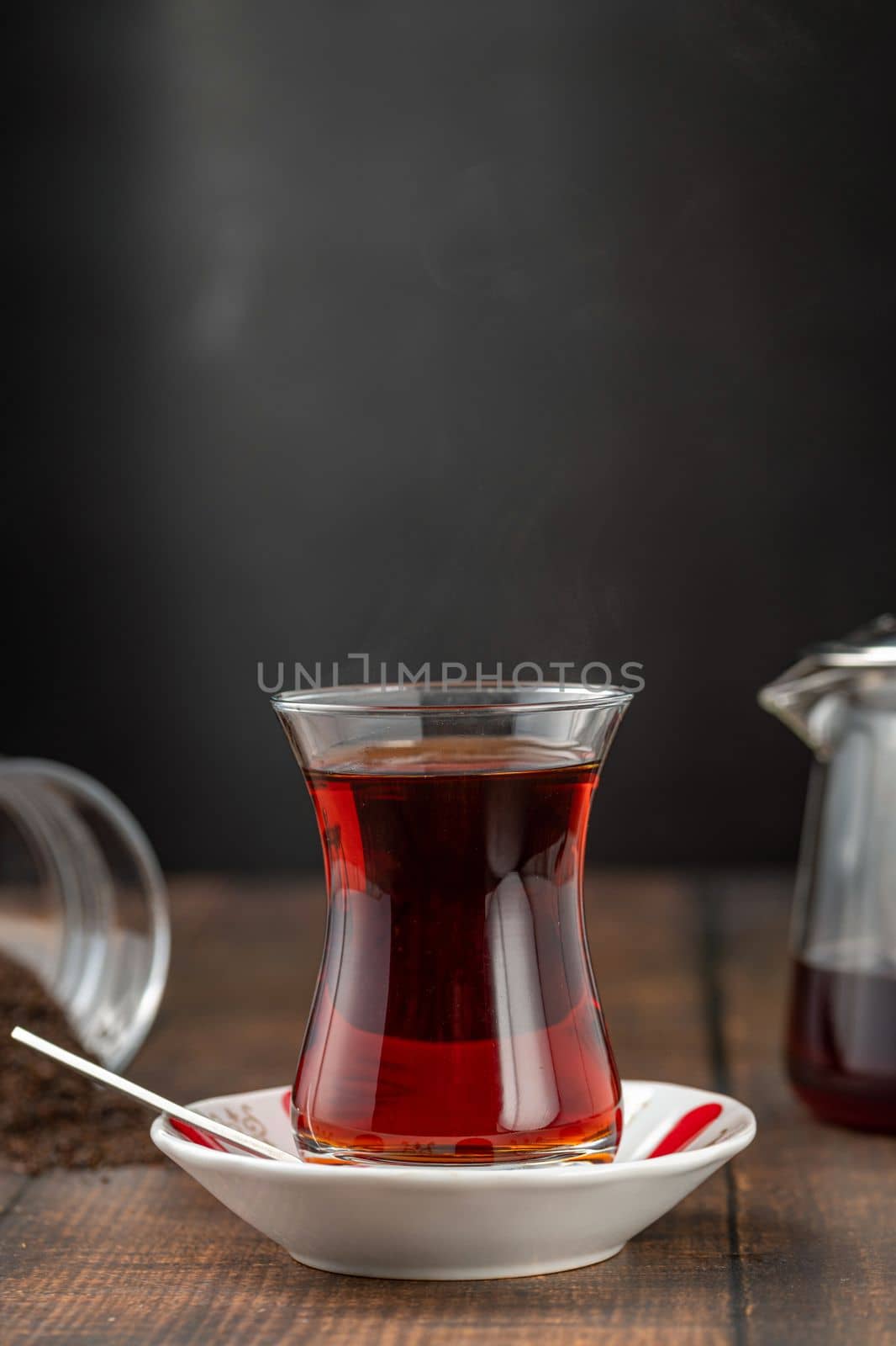 Freshly brewed turkish tea in front of dark background by Sonat