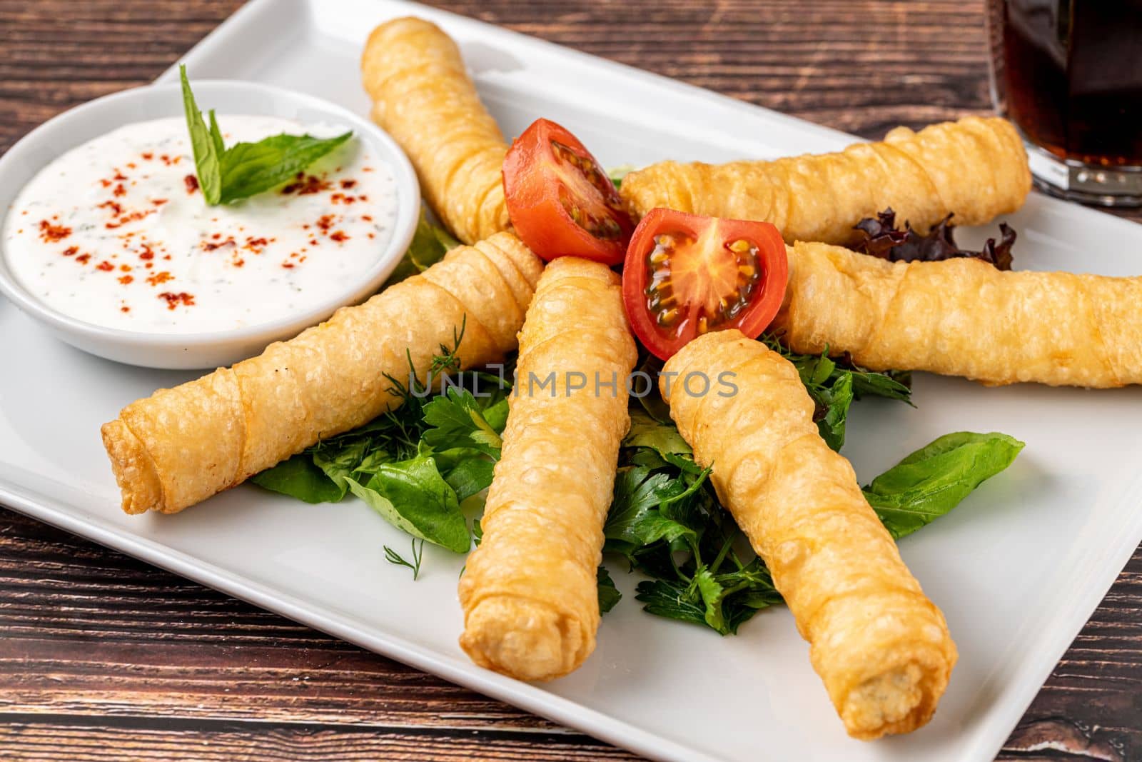 Turkish Cigar Shaped Rolls on a white porcelain plate. The Turkish name is Sigara Boregi by Sonat