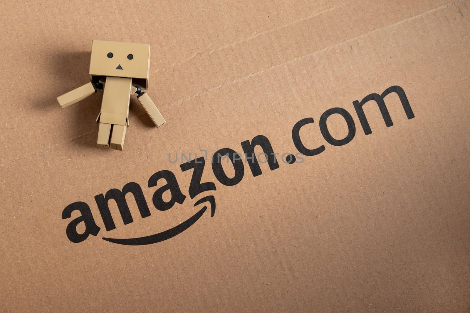 Antalya, Turkey - January 01, 2023: The logo of Amazon, a worldwide e-commerce company, printed on a Recycled cardboard box by Sonat