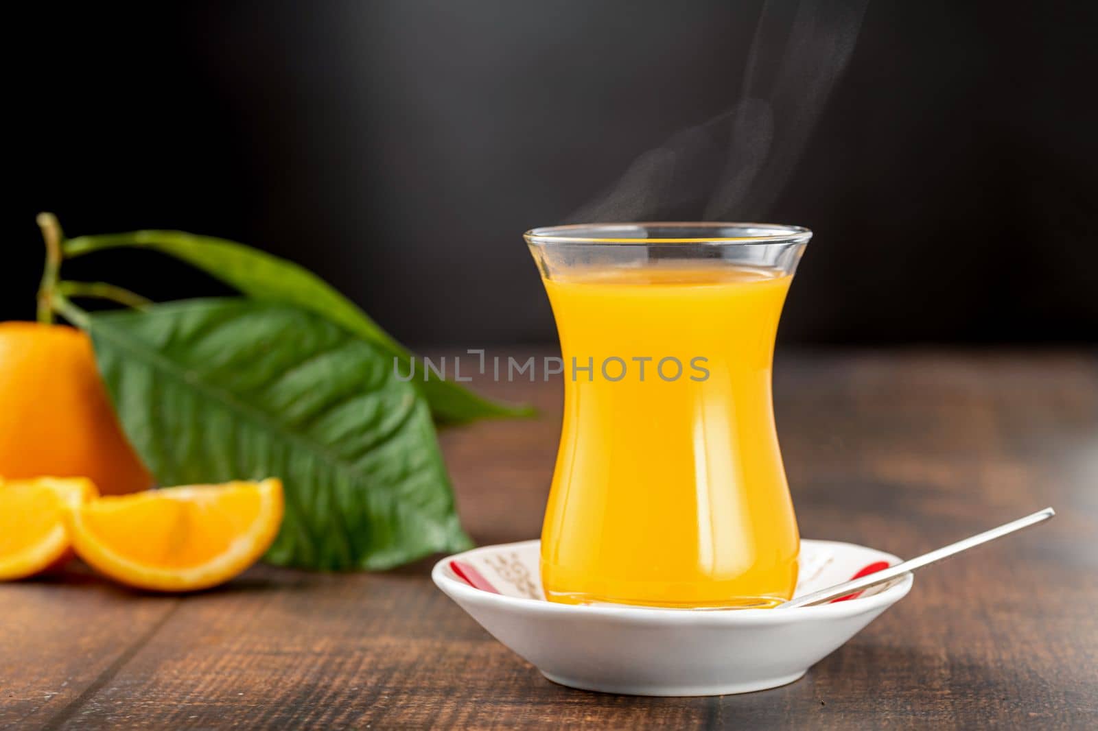 Winter drink orange oralet or oralette in a thin-waisted glass tea glass by Sonat