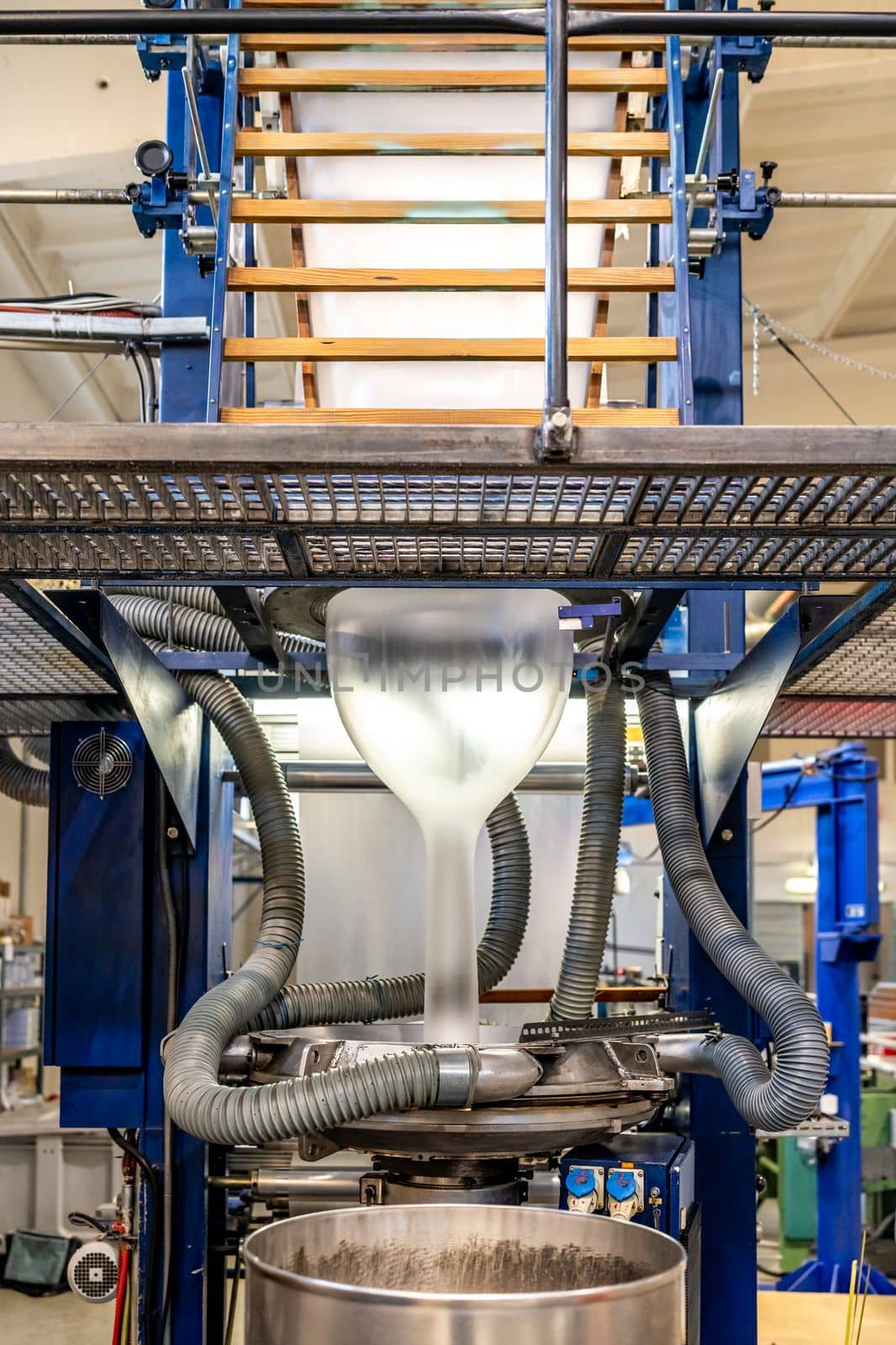 blowing plastic on a machine into a roll for the production of plastic bags. 