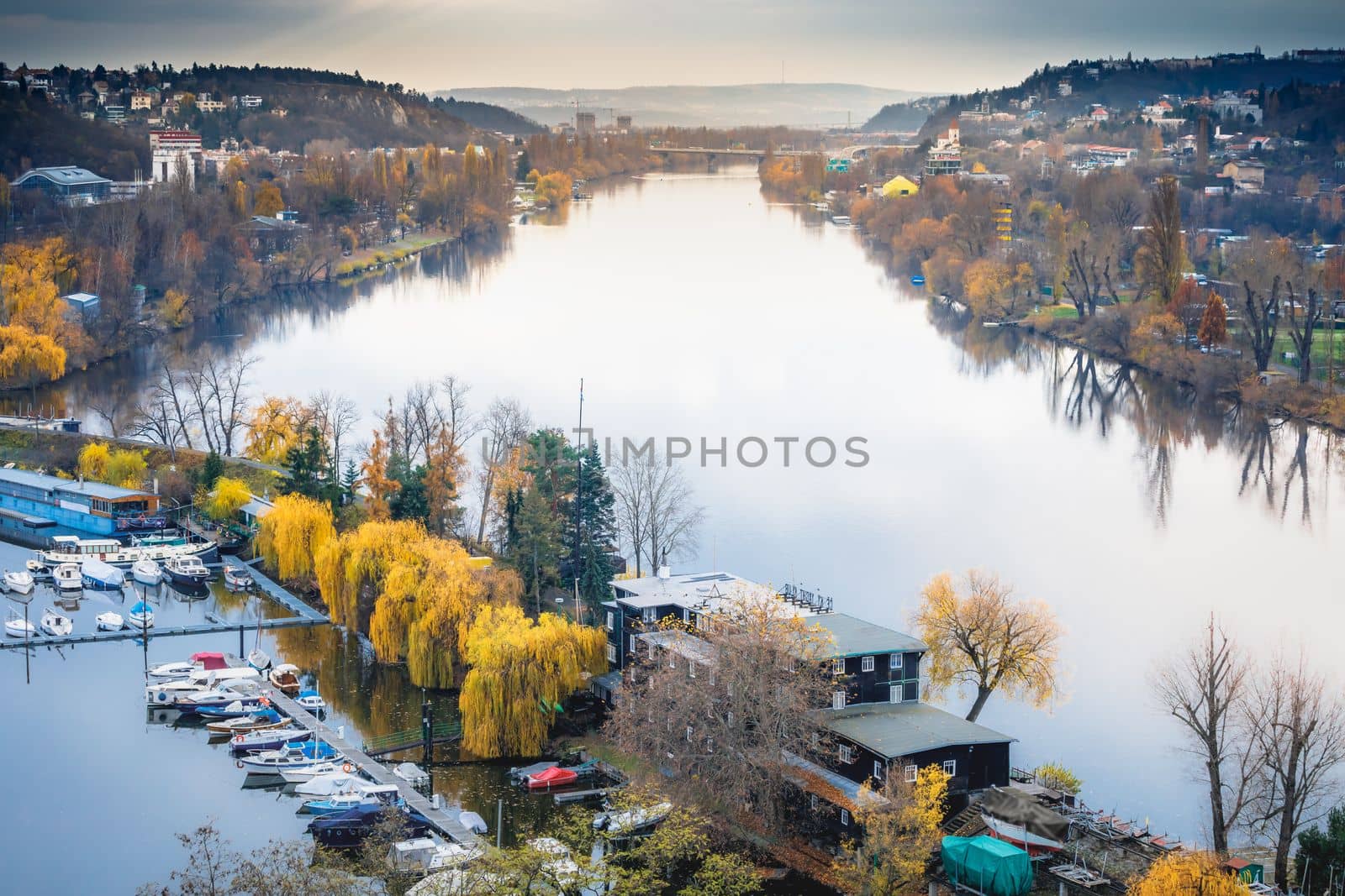Panoramic view over the cityscape of Prague and Vltava river at dramatic sunset, Czech Republic