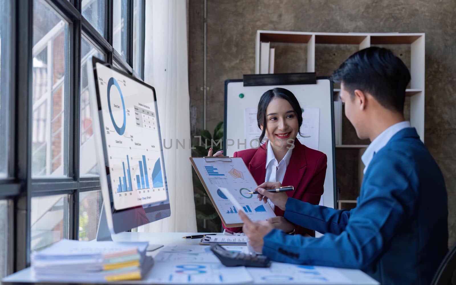 Young Asian business team creative businesspeople coworker in office. Meeting Presentation for tax analysis graph company financial. People Work in Business Office.