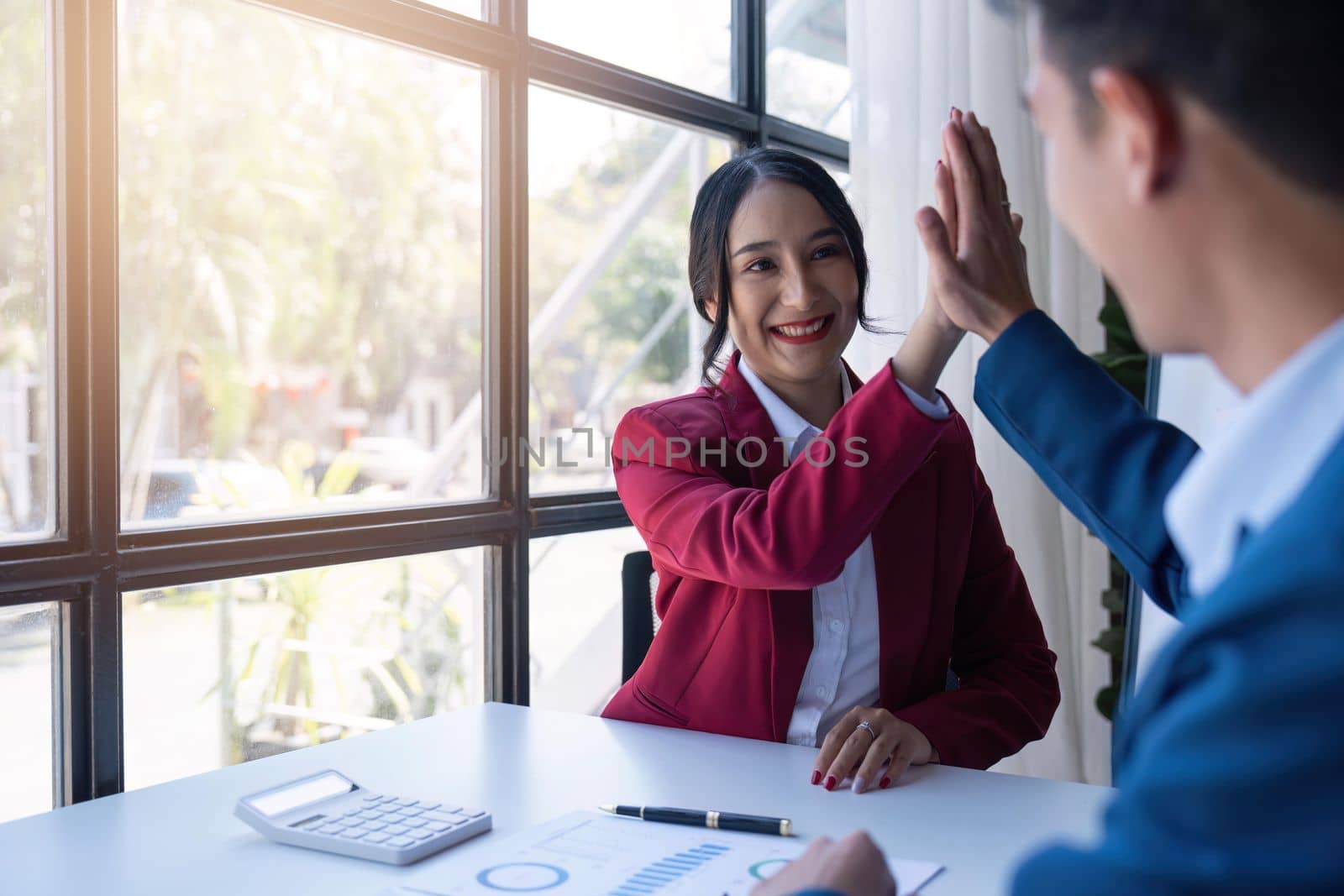 Happy smiling businessman feel happy work complete Teamwork success at work in the office concept.