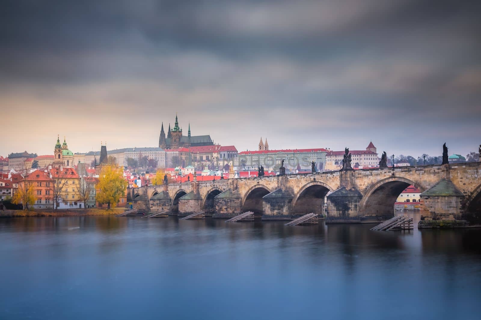 Panoramic view over the cityscape of Prague and Vltava river at dramatic sunset, Czech Republic