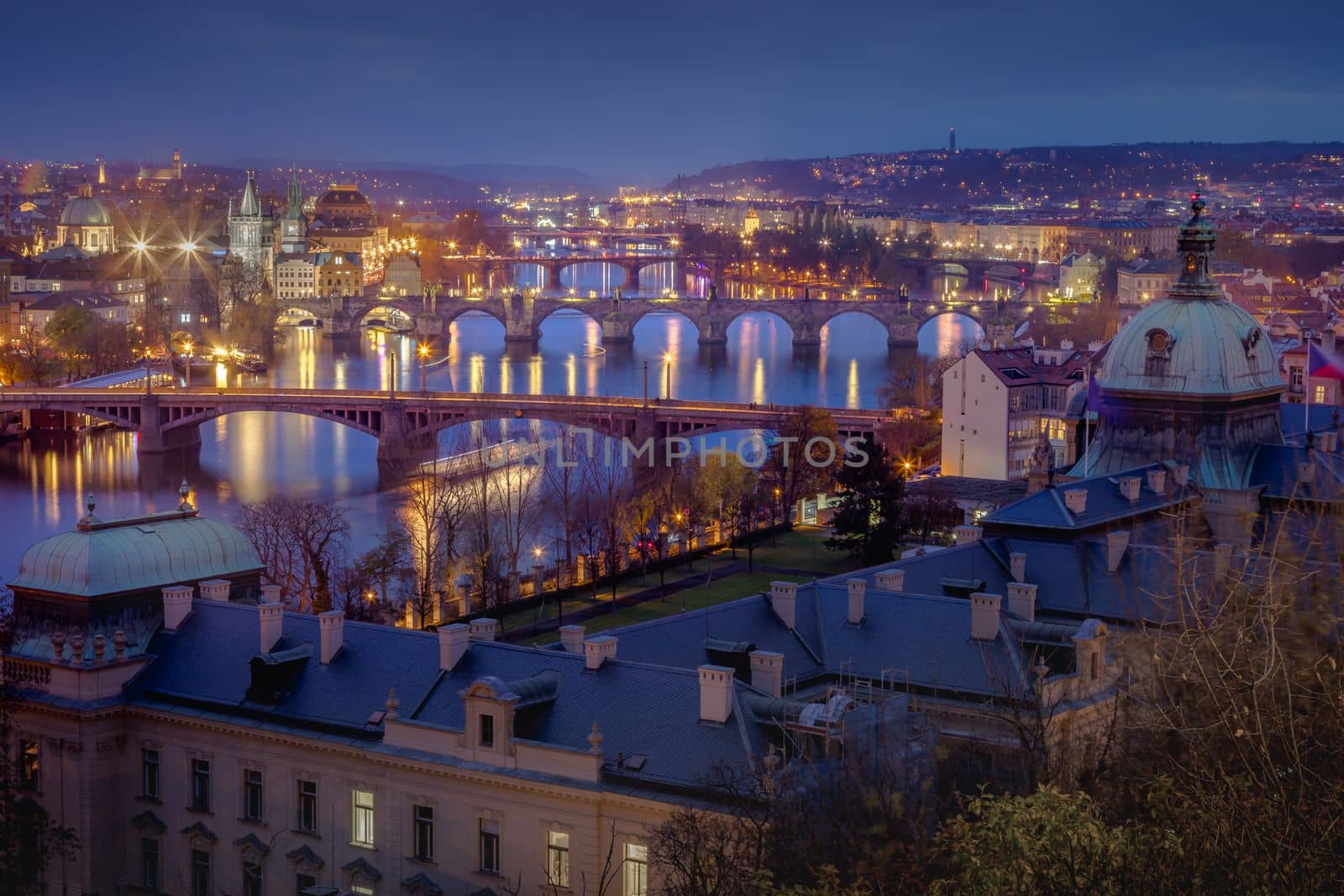 Panoramic view over the cityscape of Prague and Vltava river at dramatic evening, Czech Republic