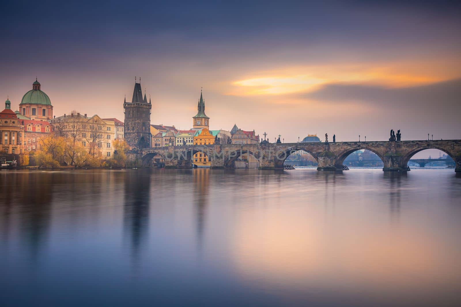 Panoramic view over the cityscape of Prague and Vltava river at dramatic evening, Czech Republic
