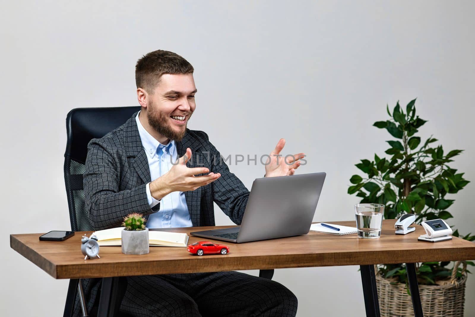 man sitting on chair at table and resting, using laptop by erstudio