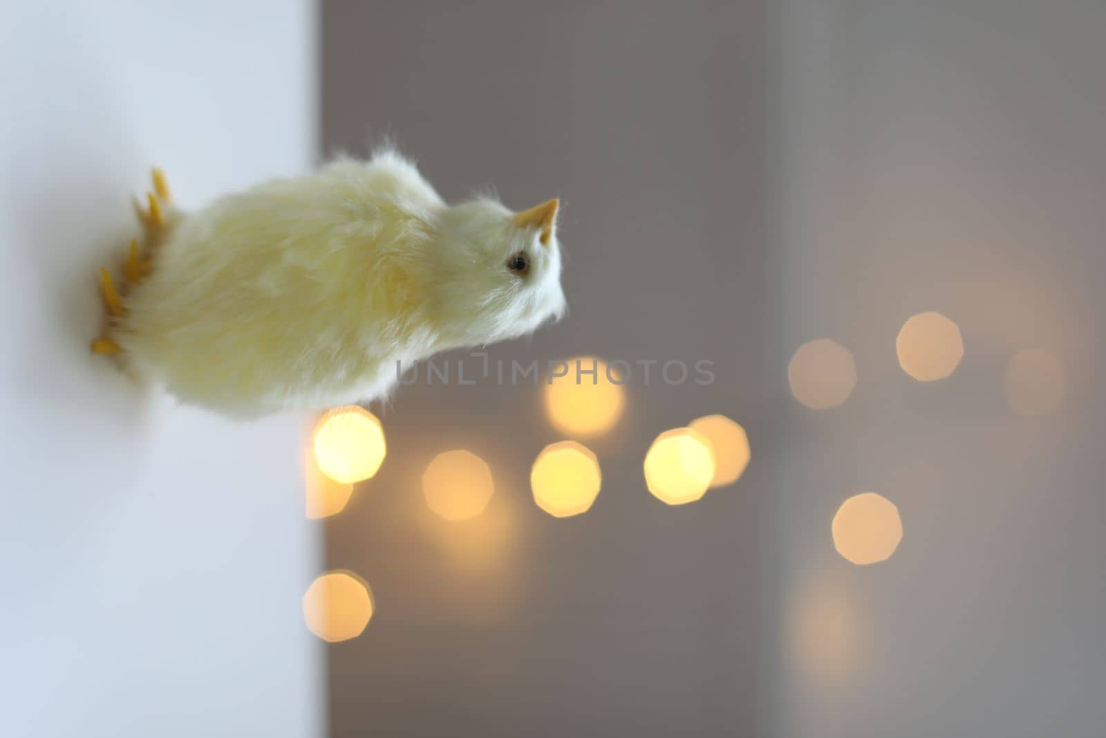 cute decorative Easter chicken on abstract blurred white background. festive composition for Easter holiday, spring season. template for design. copy space.