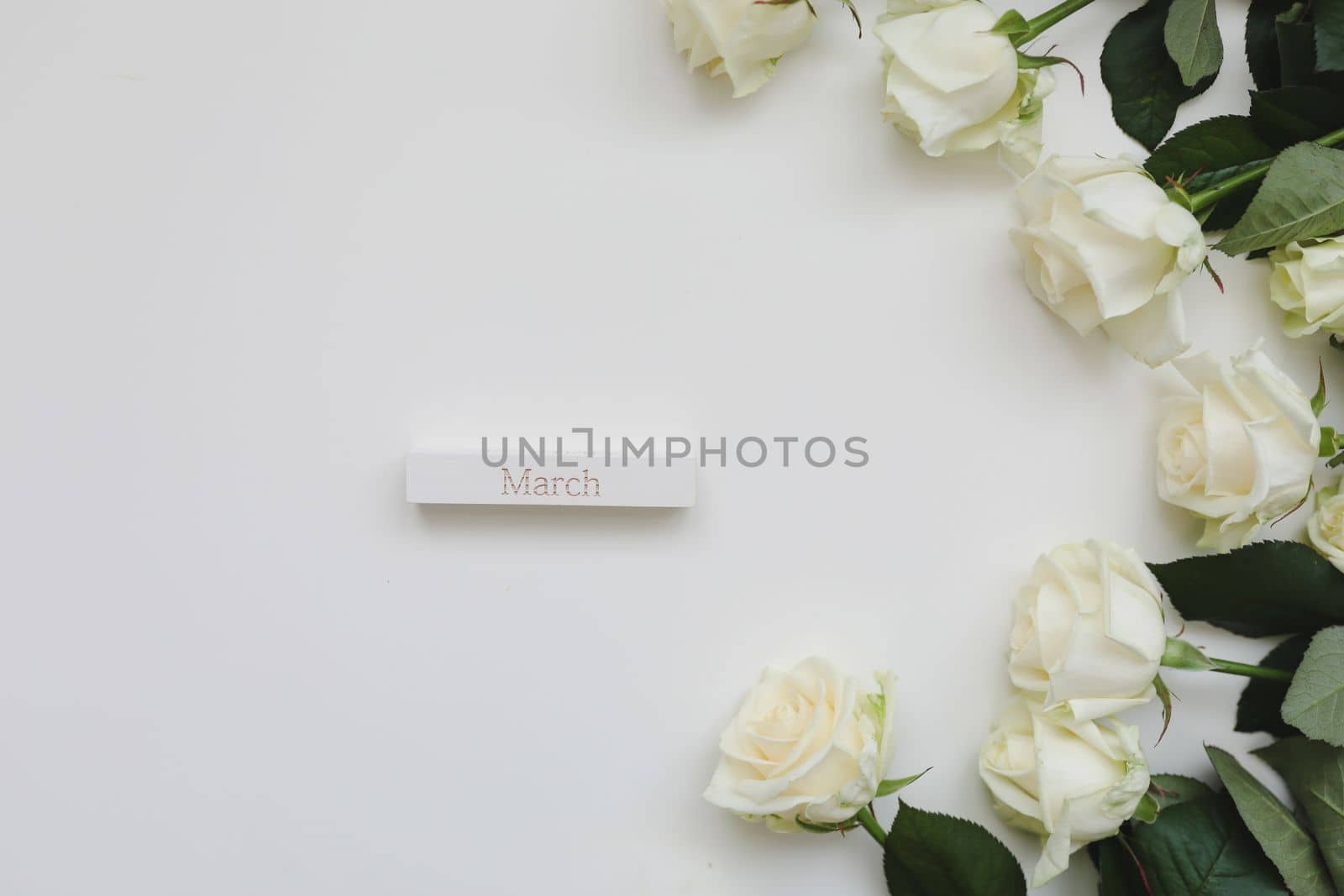 International Women's Day. Banner, flyer, beautiful postcard for March 8 with white roses and place for text on white background top view