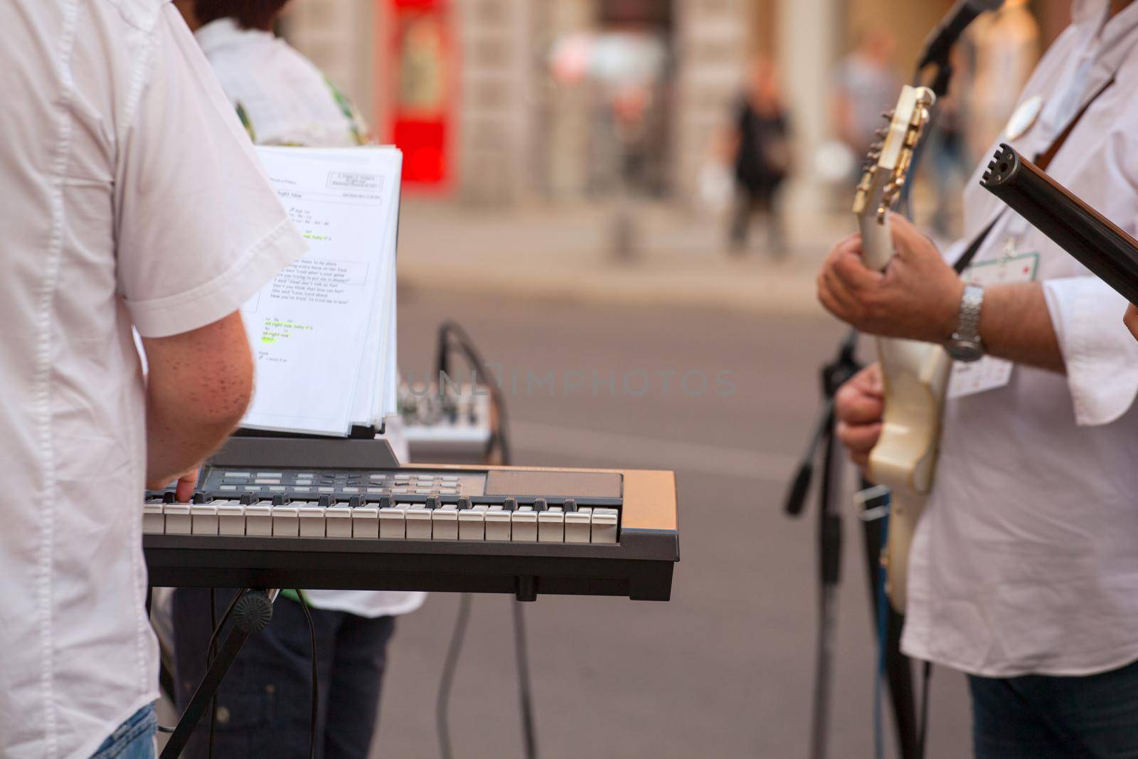 Keyboardist and guitar player during the street concert