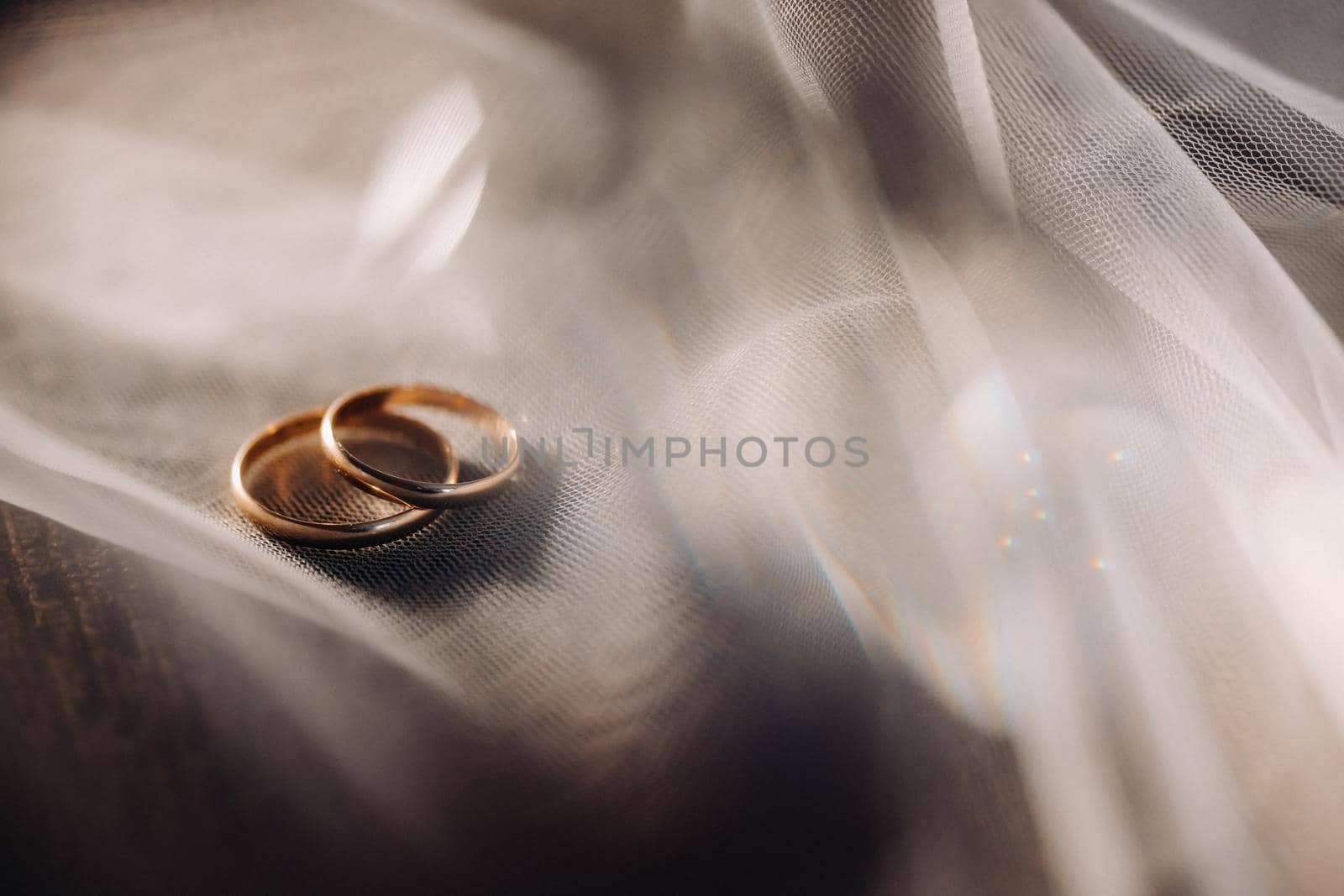 Close-up of two gold wedding rings for a wedding.