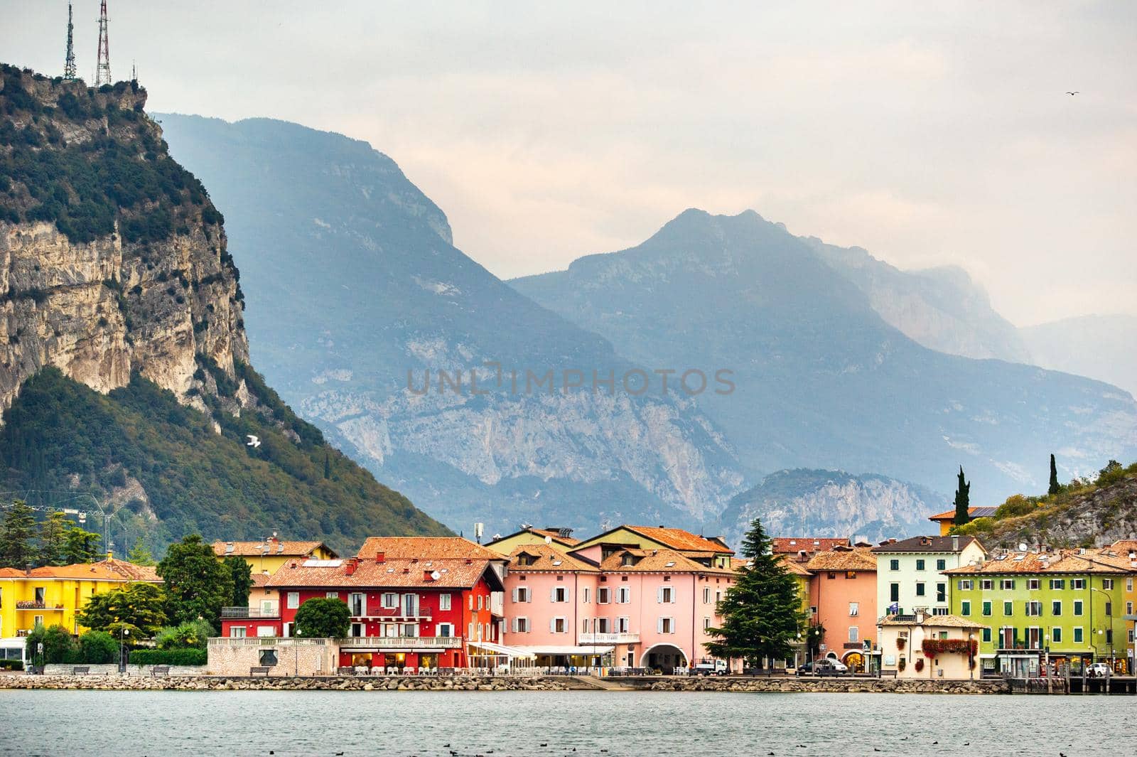 Beautiful lake Lago di Garda and the village of Torbole, Alpine scenery. Italy.