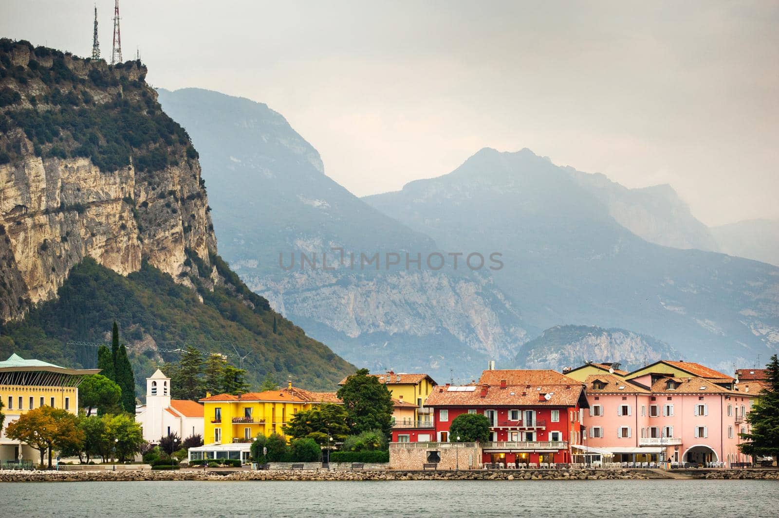 Beautiful lake Lago di Garda and the village of Torbole, Alpine scenery. Italy.