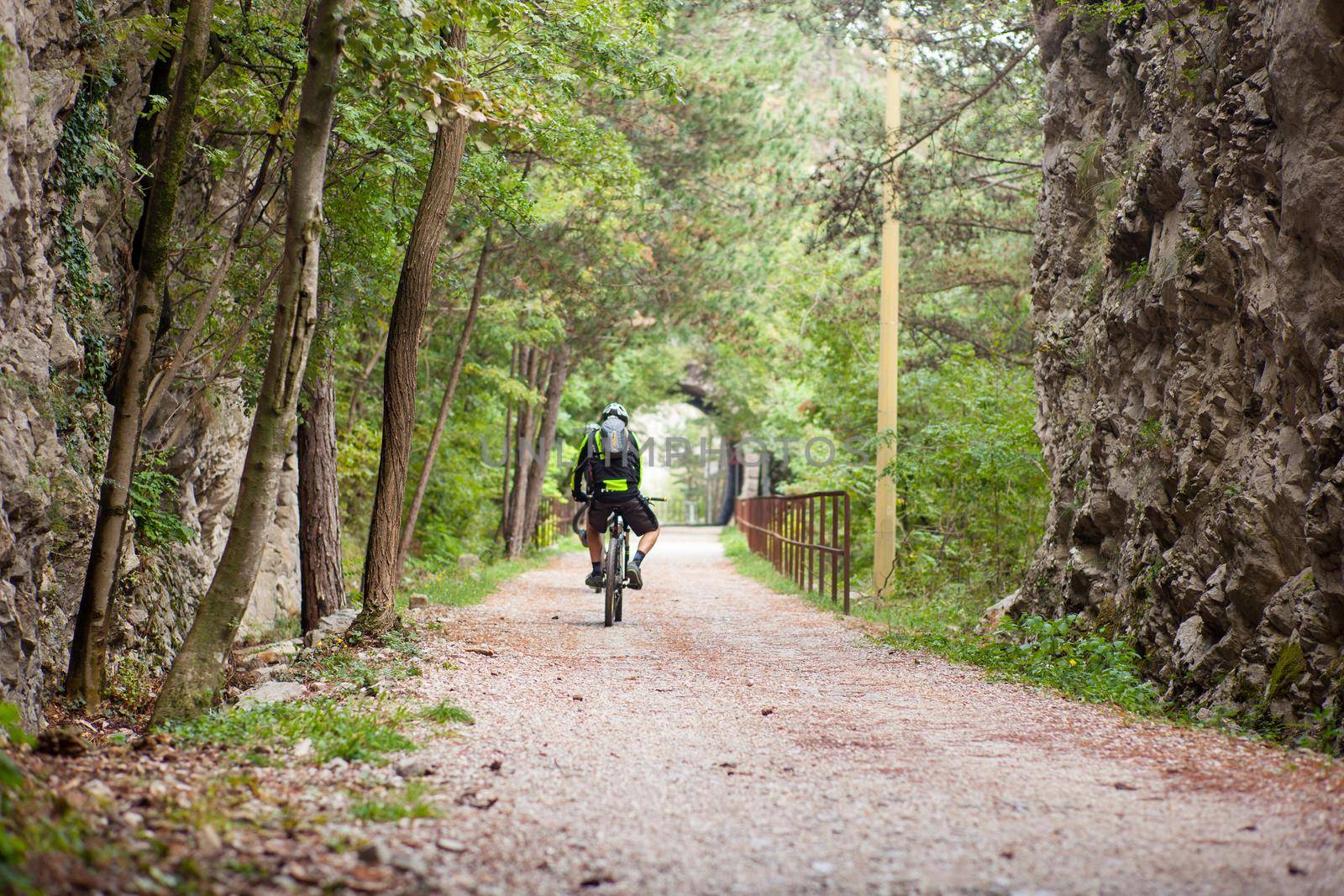 Mountain Bike cyclist riding countryside track, Val Rosandra. Italy