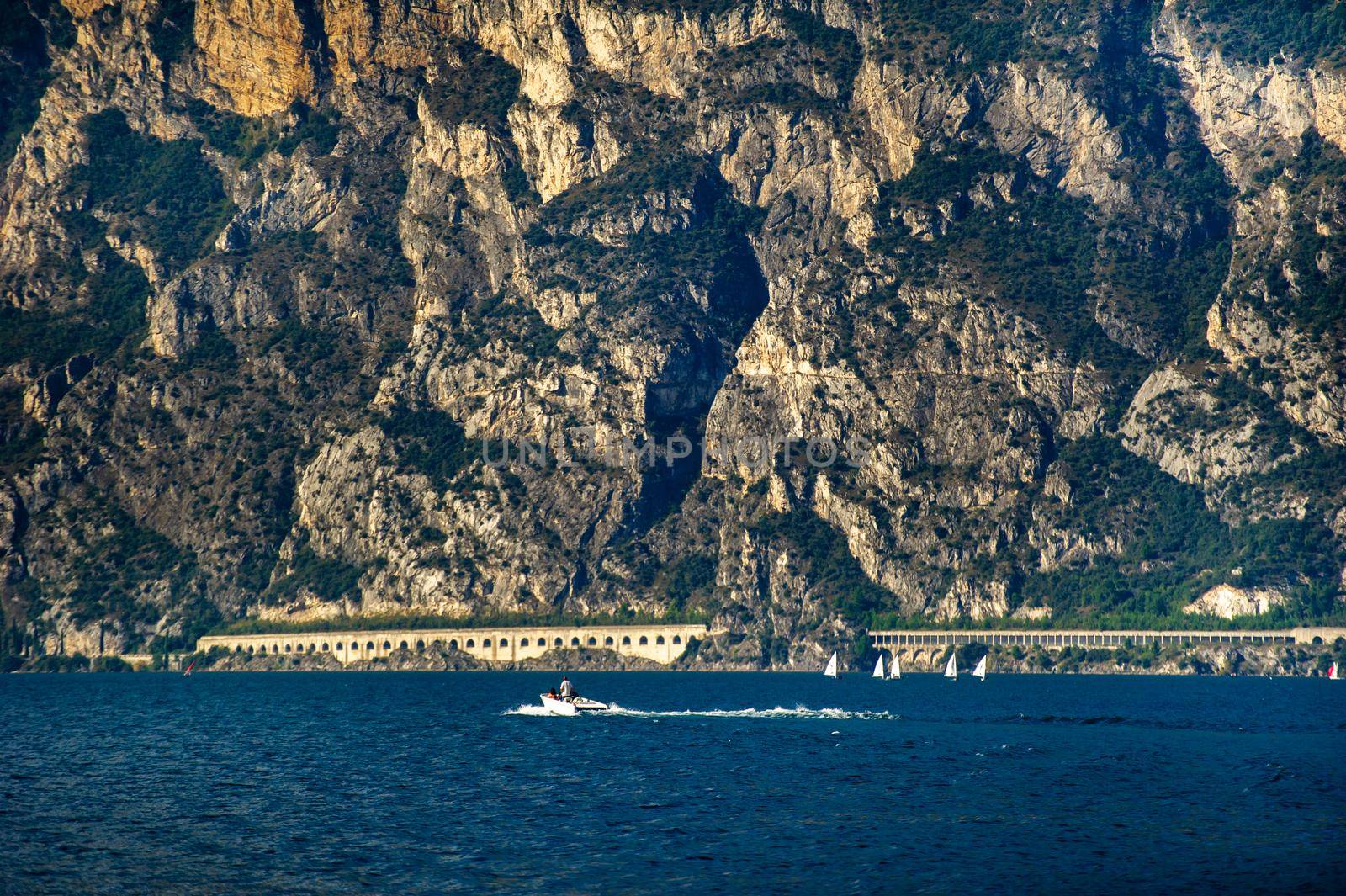 The promenade on Lake Garda and the Alps.Italy.Tuscany.