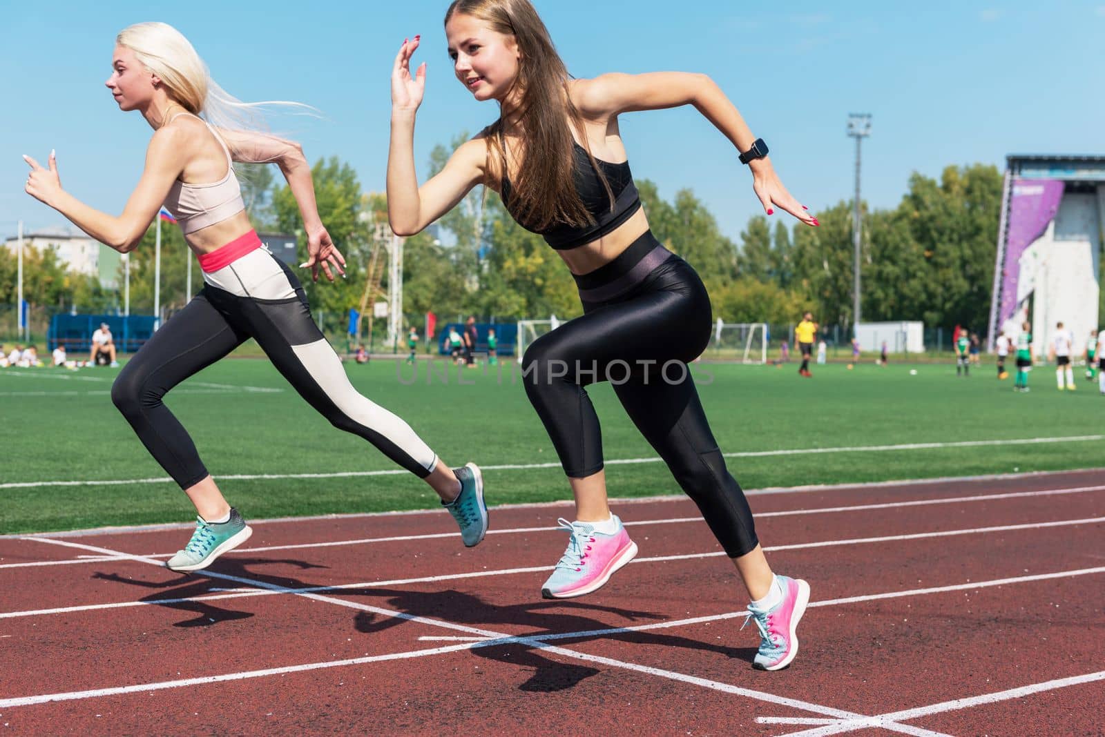 Two athlete woman runnner are training by rusak