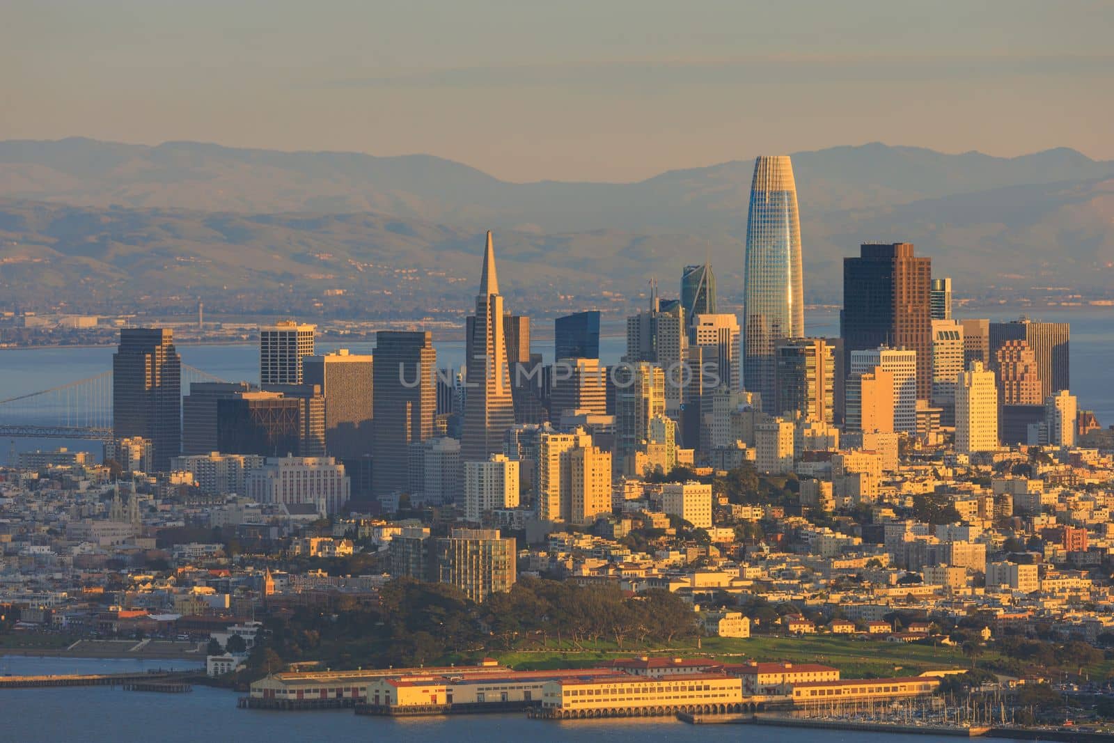 Afternoon sun hits high rise buildings of downtown San Francisco skyline by Osaze