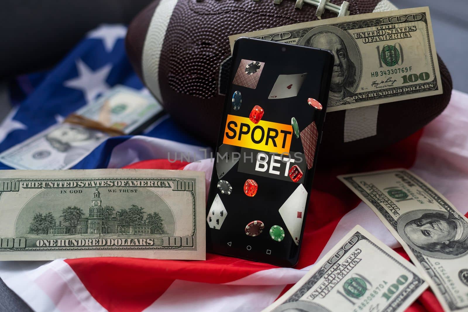 smartphone, money and rugby ball on light background. Concept of sports bet by Andelov13