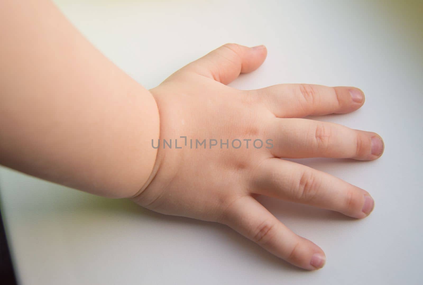 Child hand showing the five fingers isolated on a white background by claire_lucia