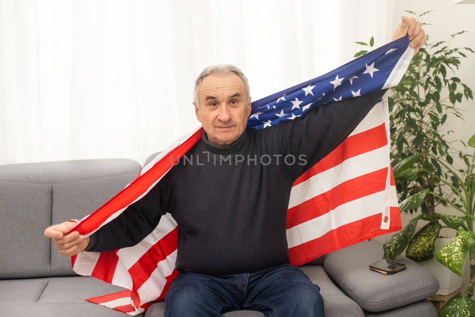 senior American man and an American flag.