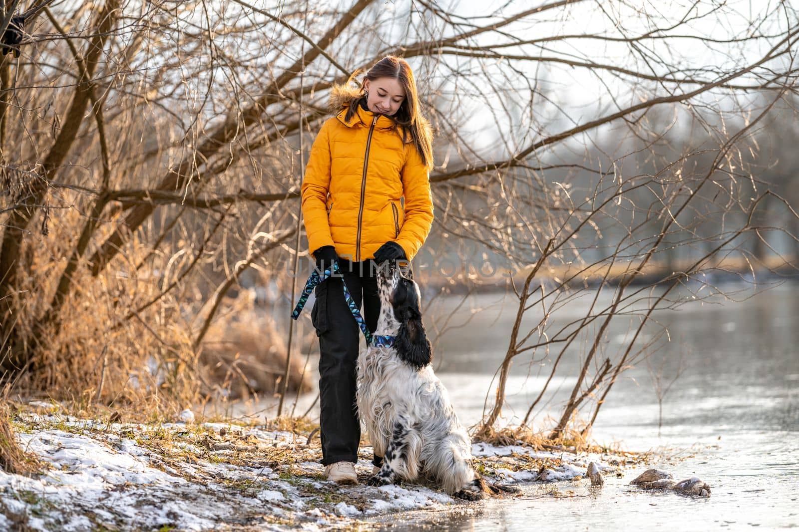 a girl with a dog by a frozen lake. english setter by Edophoto