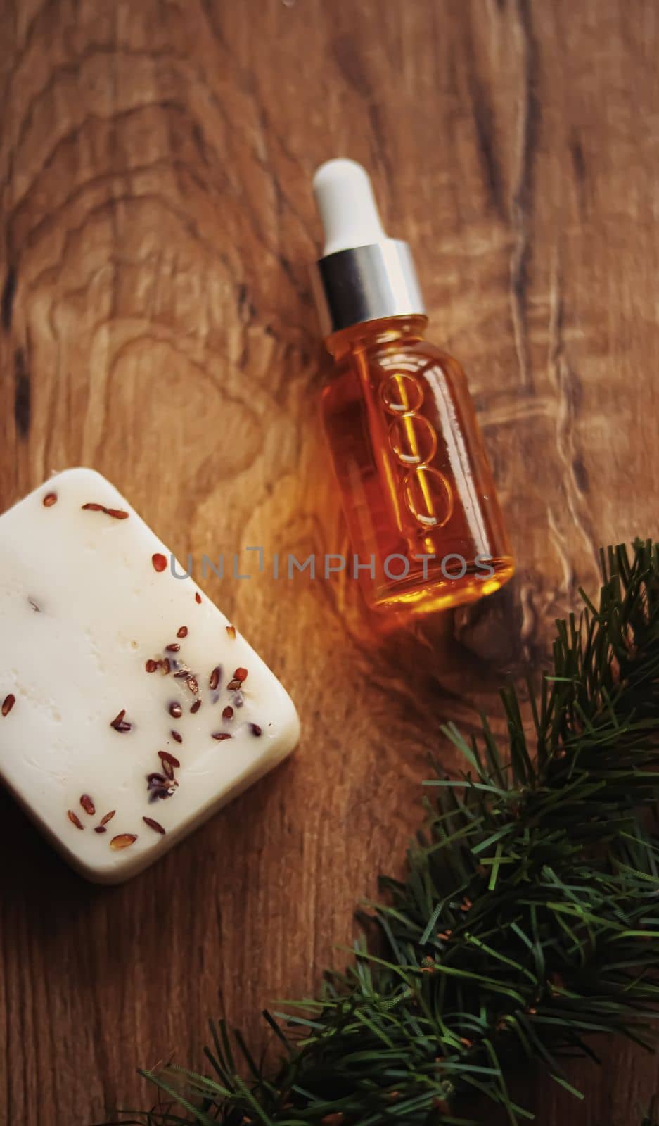 Oil serum bottle and natural herbal handmade soap, beauty and skincare product.