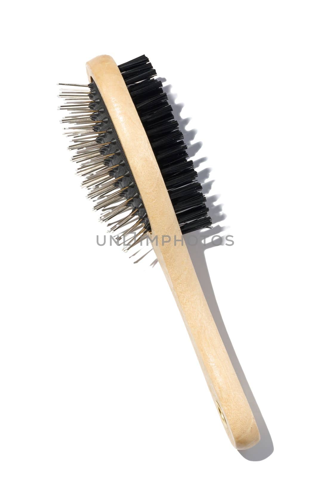 Wooden brush for animals on a white isolated background