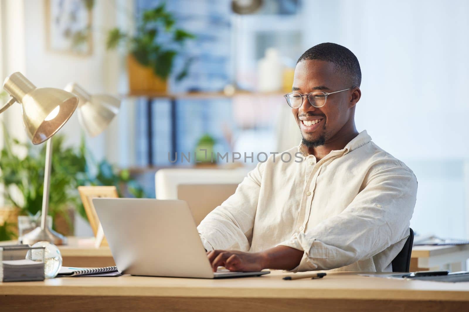 Working on building his empire. a young businessman working on his laptop at his desk